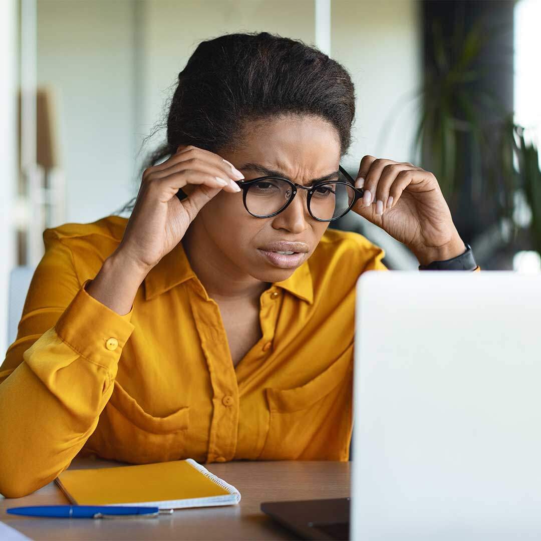 Woman Squinting at the Computer - Make Your Website ADA Compliant